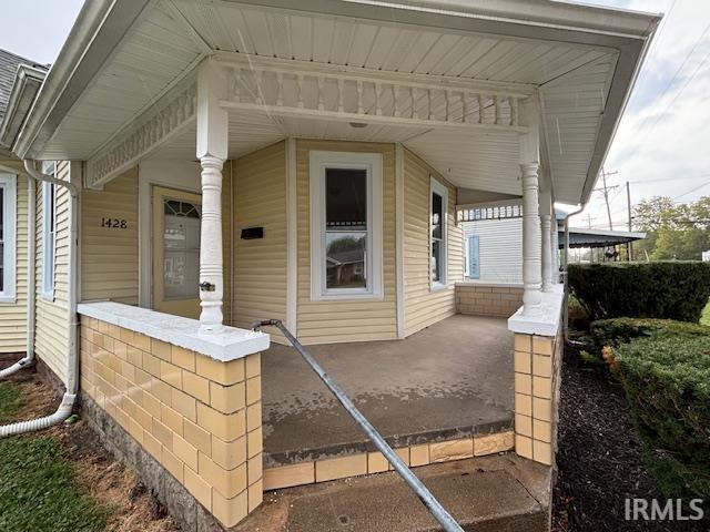 entrance to property with covered porch