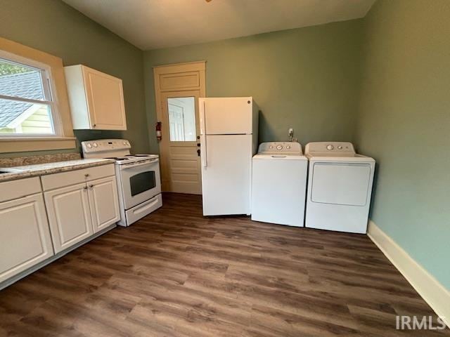 laundry area with dark hardwood / wood-style flooring and washer and dryer