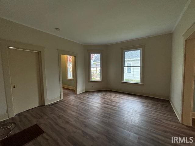 unfurnished bedroom with dark wood-type flooring