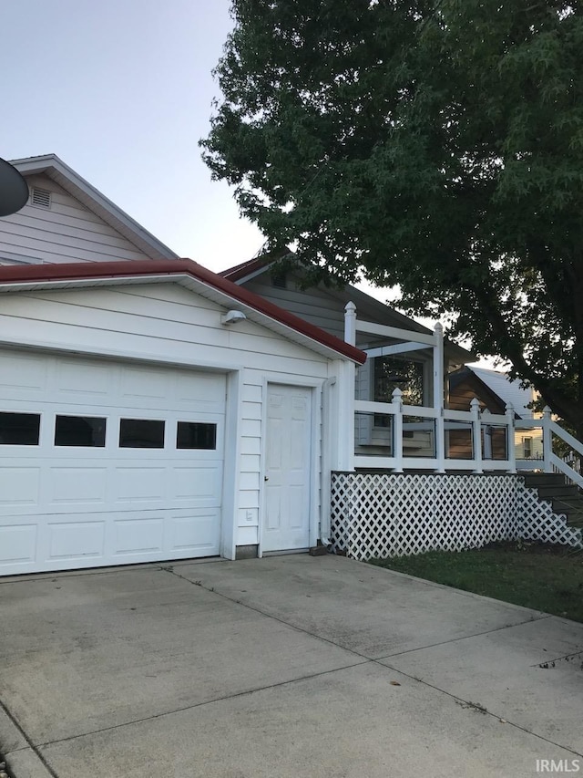 view of home's exterior featuring driveway