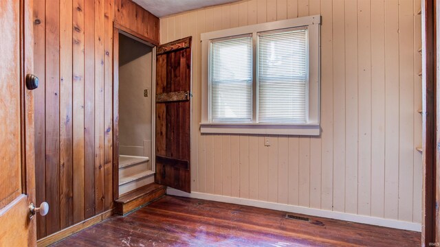 unfurnished room featuring wood-type flooring