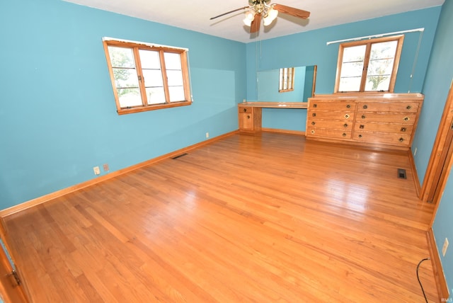 unfurnished bedroom featuring ceiling fan and light hardwood / wood-style flooring