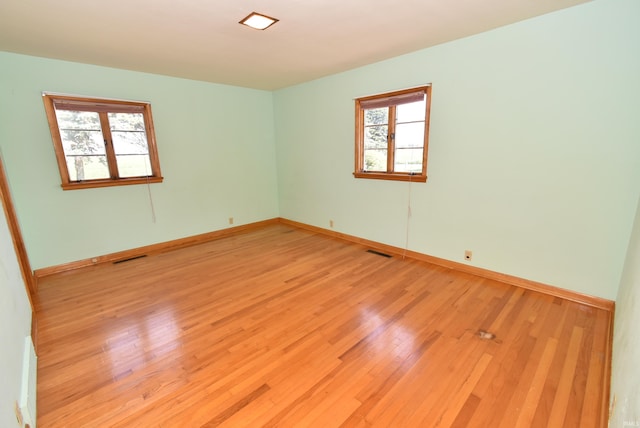 unfurnished room featuring light wood-type flooring