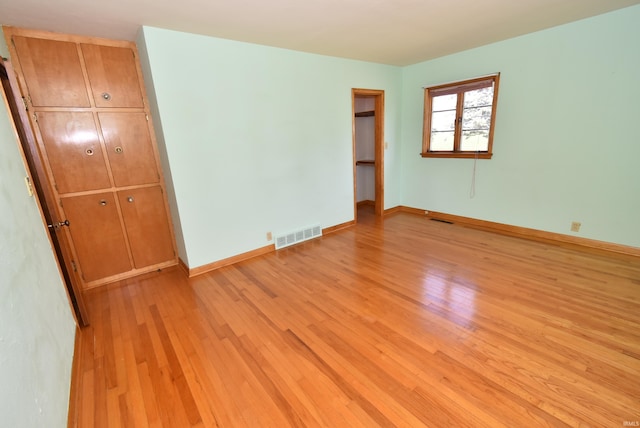 unfurnished room with light hardwood / wood-style flooring