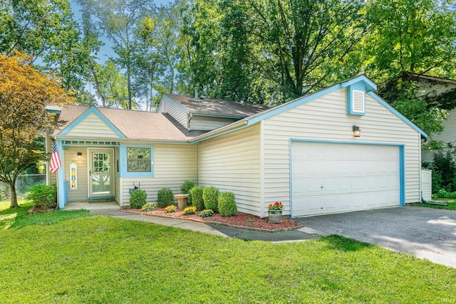 view of front of home featuring a garage and a front yard