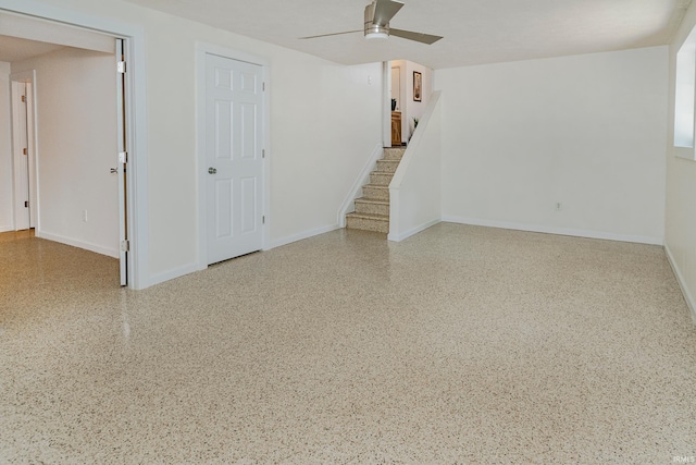 interior space with ceiling fan