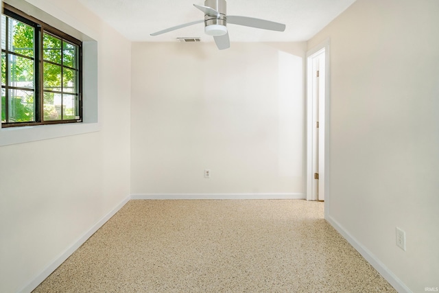 unfurnished room with ceiling fan