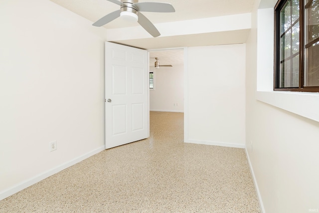 unfurnished room with ceiling fan