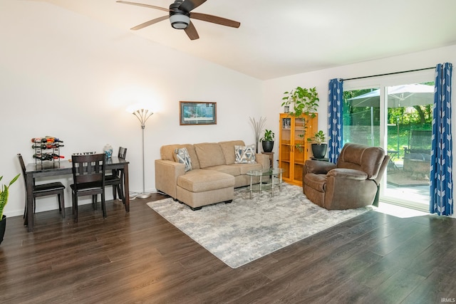 living room with dark hardwood / wood-style flooring, ceiling fan, and lofted ceiling