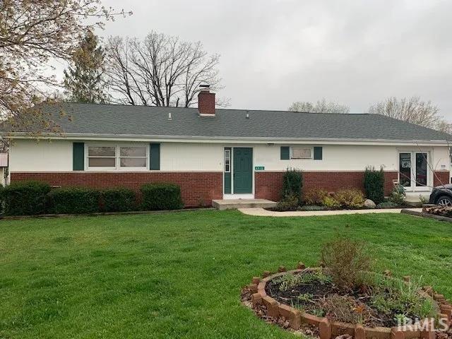 ranch-style house with a front lawn