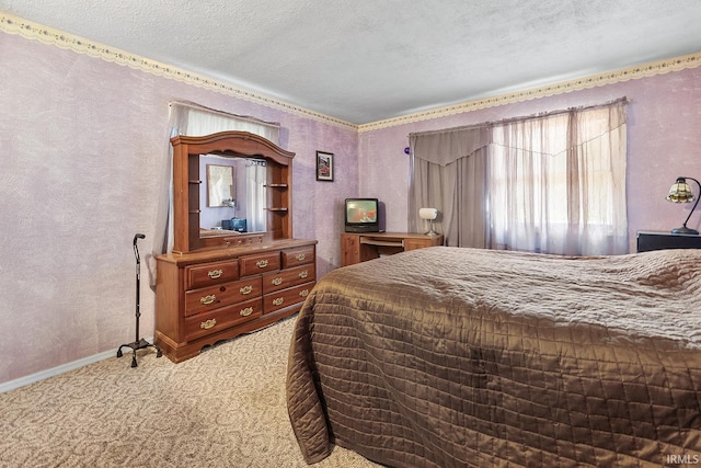 carpeted bedroom featuring a textured ceiling