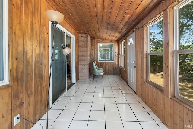 unfurnished sunroom featuring wooden ceiling