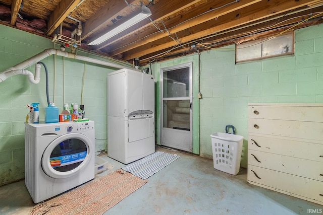 clothes washing area featuring washer and clothes dryer