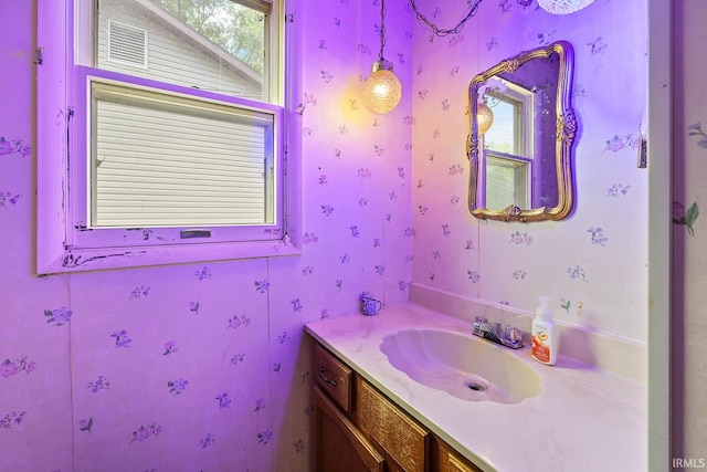 bathroom with a wealth of natural light and vanity