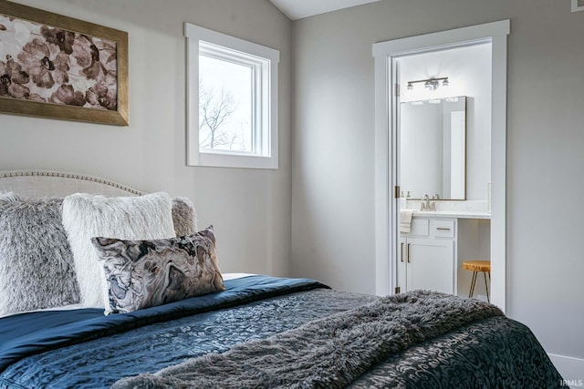 bedroom featuring ensuite bath