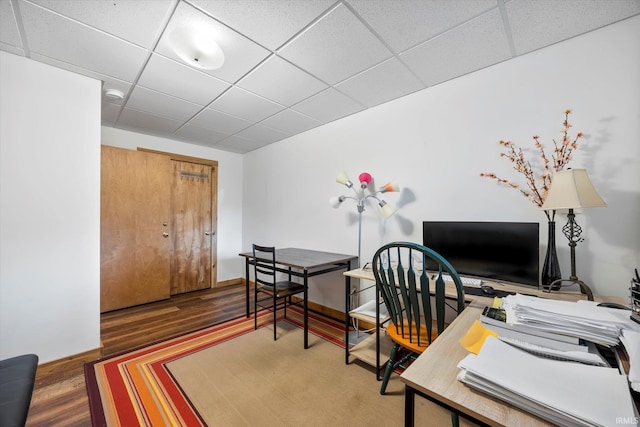 office area featuring a drop ceiling and wood finished floors