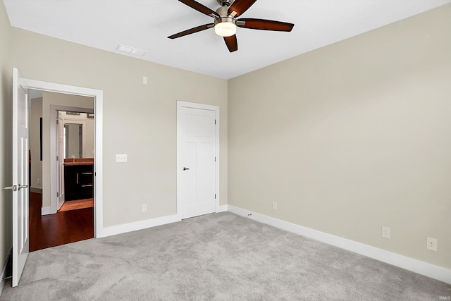 unfurnished bedroom with ceiling fan and carpet flooring