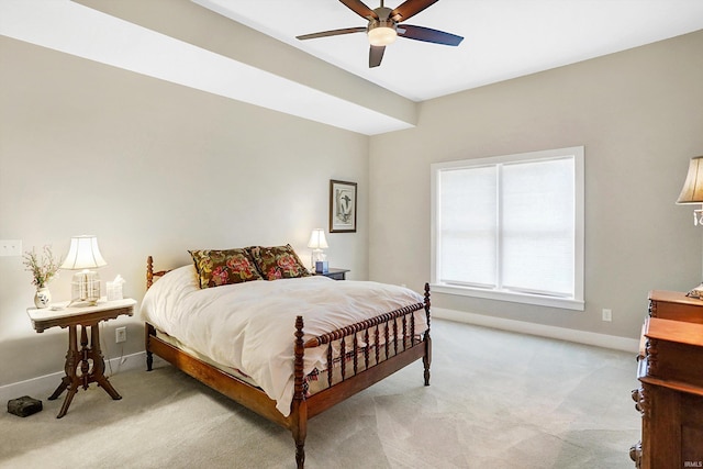 bedroom featuring light carpet and ceiling fan