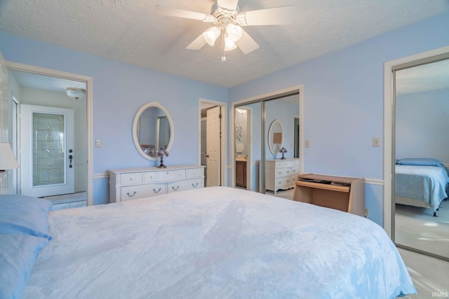 bedroom featuring ceiling fan and a textured ceiling