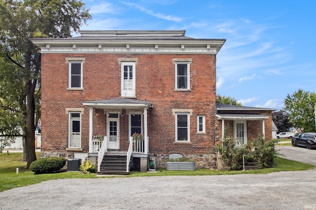 italianate home featuring central AC unit