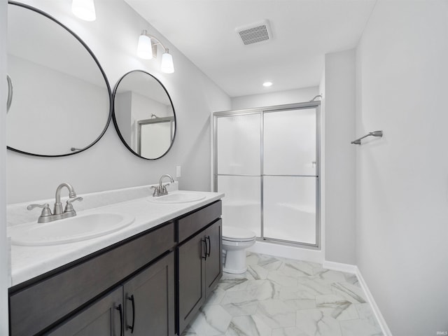 bathroom with tile patterned flooring, toilet, a shower with door, and vanity