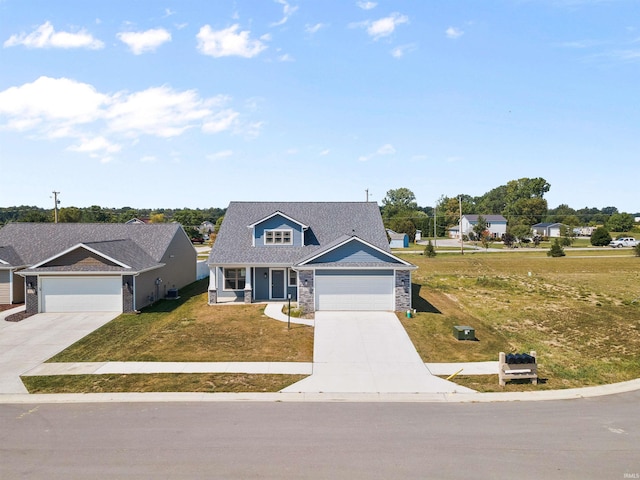 view of front of property with a garage and a front yard