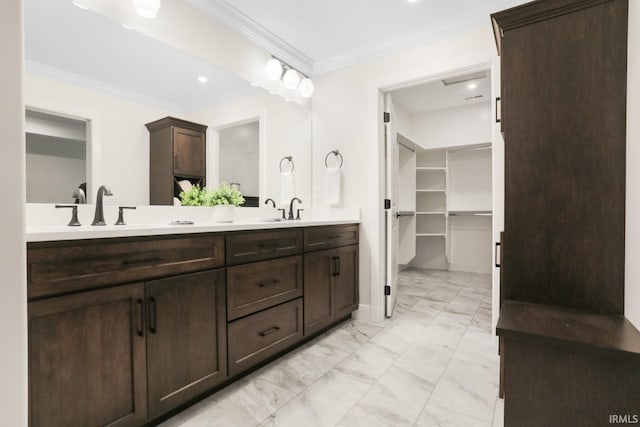 bathroom featuring crown molding, vanity, and tile patterned floors