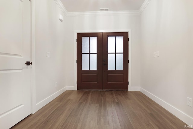 entryway featuring ornamental molding, french doors, and hardwood / wood-style flooring