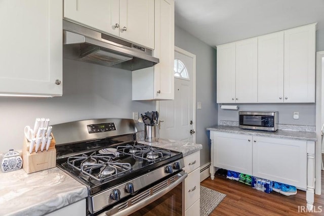 kitchen featuring dark wood-style flooring, appliances with stainless steel finishes, a baseboard heating unit, white cabinetry, and under cabinet range hood