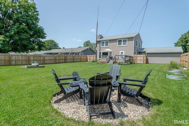 view of yard featuring a fire pit and a deck