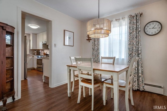 dining space with a chandelier, a baseboard radiator, dark wood-style flooring, and baseboards