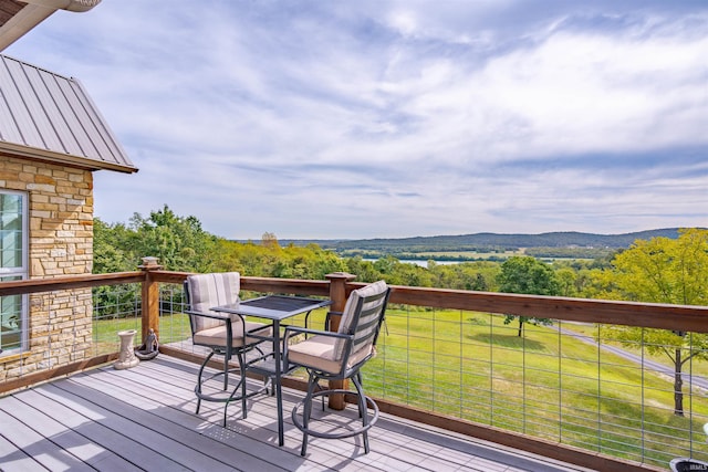 wooden deck featuring a wooded view