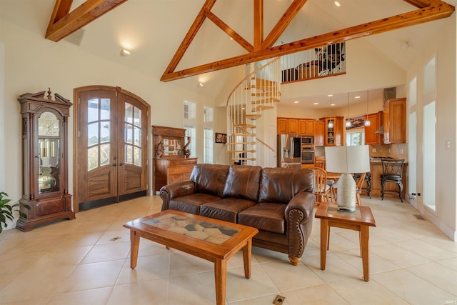 living area featuring stairs, french doors, light tile patterned floors, and beam ceiling