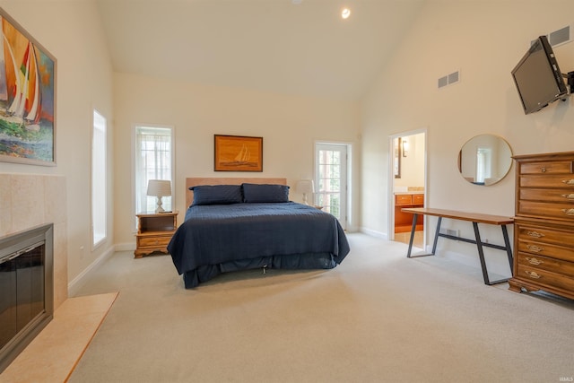 carpeted bedroom featuring baseboards, visible vents, high vaulted ceiling, and a fireplace