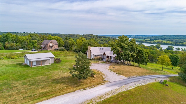 bird's eye view with a water view and a view of trees
