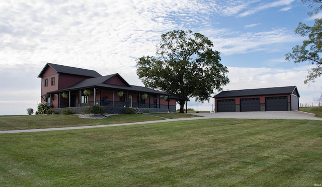 farmhouse-style home with a detached garage, a porch, a front yard, stone siding, and an outdoor structure