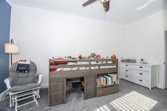 carpeted bedroom featuring crown molding and ceiling fan