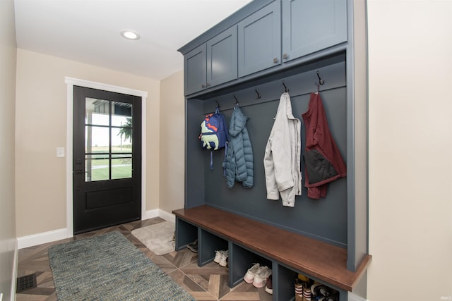 mudroom with recessed lighting, visible vents, and baseboards