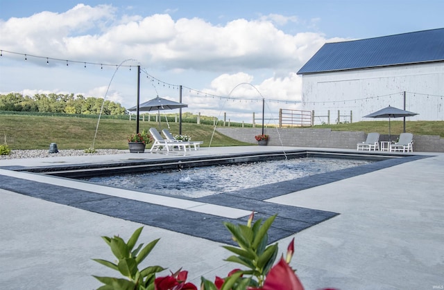 pool with a patio