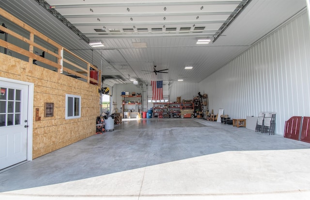 garage with metal wall and a workshop area