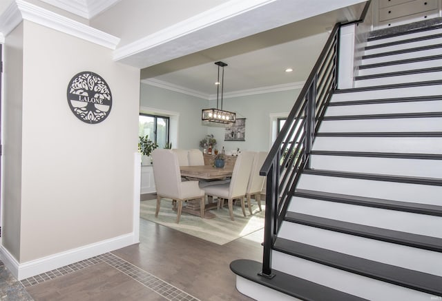 dining room with dark wood-style floors, crown molding, recessed lighting, stairway, and baseboards