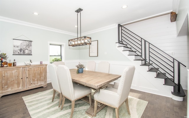 dining room featuring a decorative wall, recessed lighting, stairs, dark wood-style floors, and crown molding