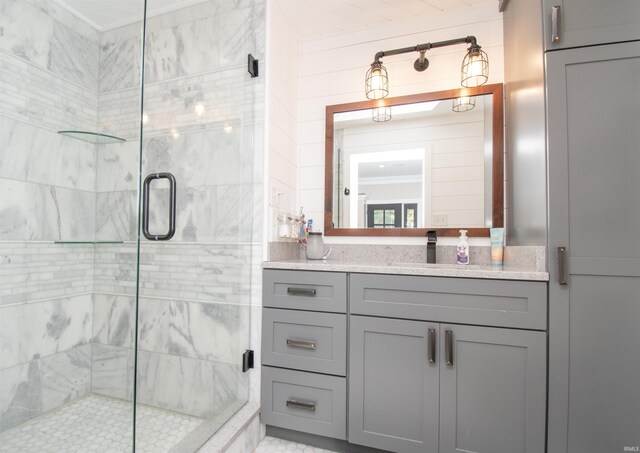 bathroom with a stall shower and vanity