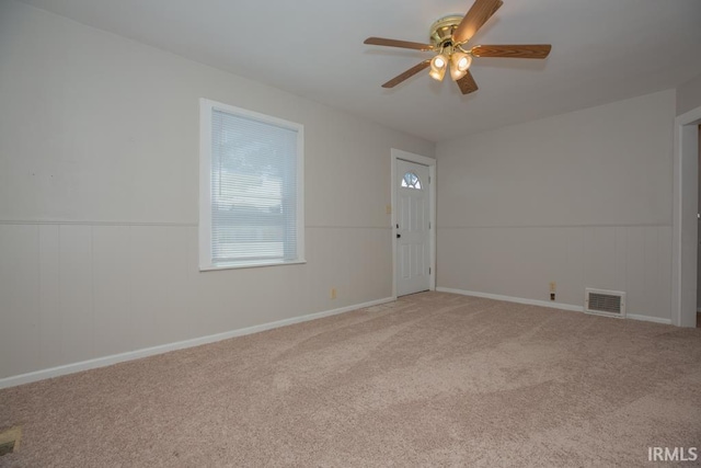 carpeted empty room with ceiling fan