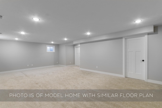 basement featuring baseboards, carpet floors, and recessed lighting