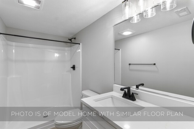 full bath with toilet, visible vents, shower / bathing tub combination, and vanity