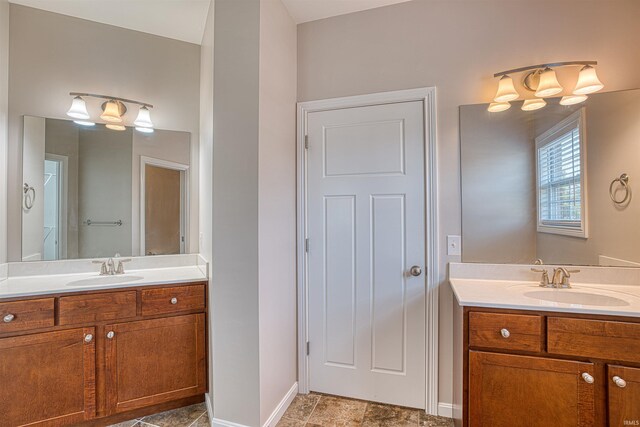 bathroom featuring vanity and a shower with door