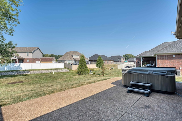 view of patio / terrace with a hot tub