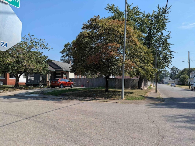 view of street with curbs, street lighting, and sidewalks