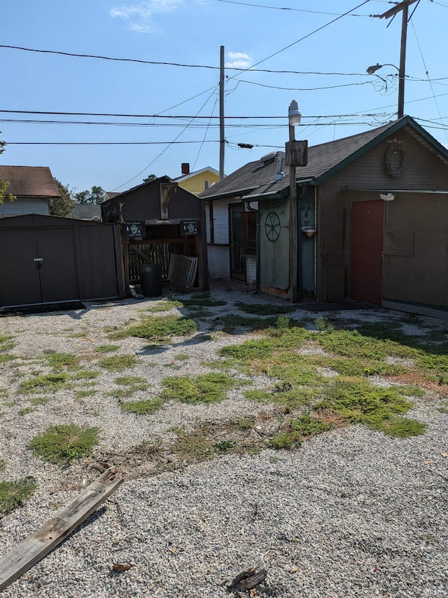 exterior space with driveway and fence